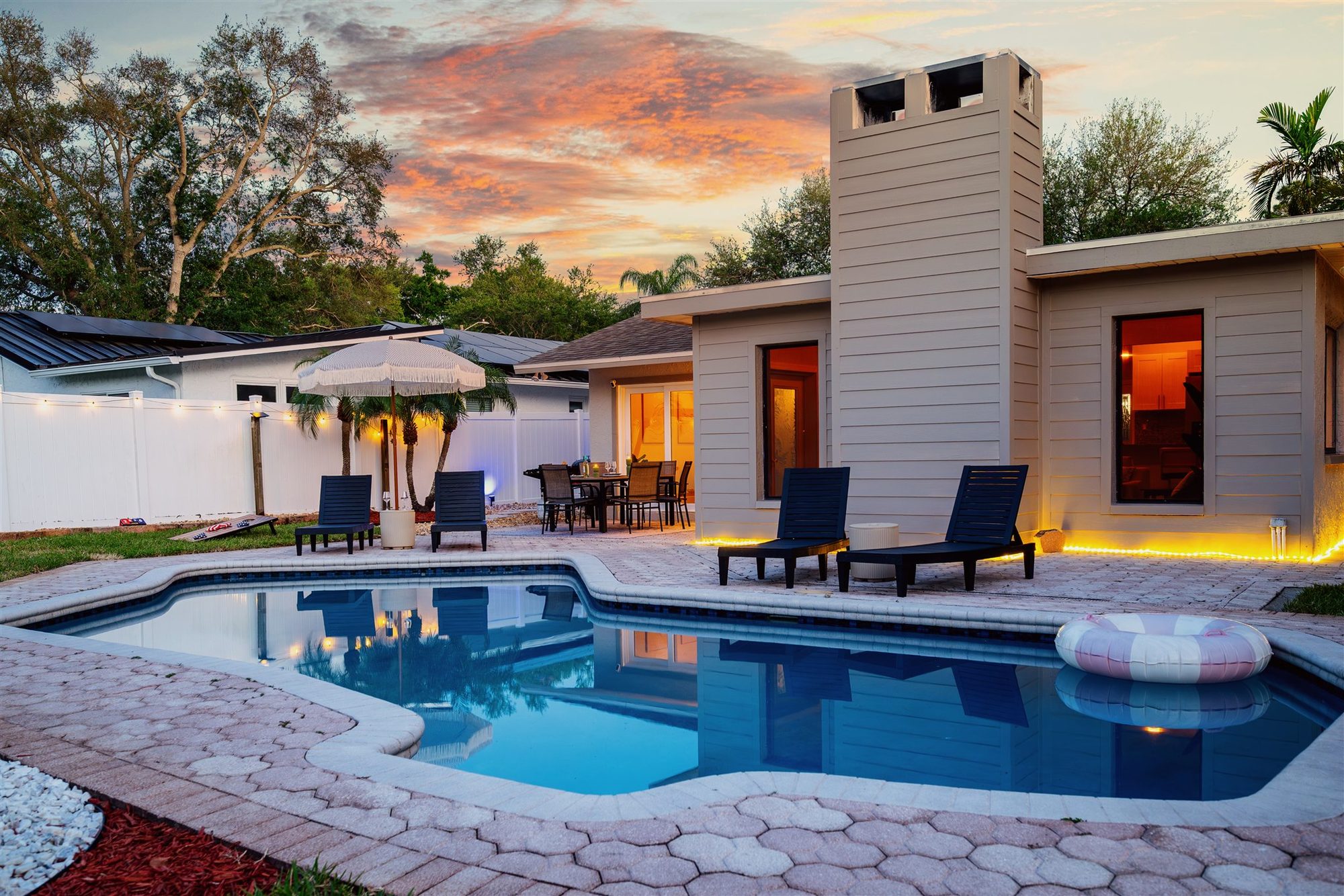 Rustic Pines fire pit and pool at sunset